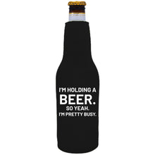 Load image into Gallery viewer, 12oz. neoprene beer bottle koozie with zipper closure on one side and "I'm Holding a Beer,," graphic printed on the opposite side.