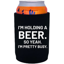 Load image into Gallery viewer, neoprene, full bottom 12oz. can koozie with &quot;I&#39;m holding a beer&quot; graphic printed on one side.
