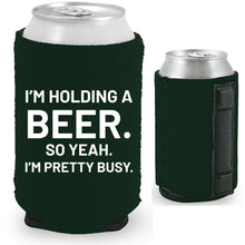 Load image into Gallery viewer, 12oz. collapsible, neoprene can koozie with strong magnets sewn into one side; "I'm holding a beer.." graphic printed on opposite side.