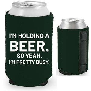 12oz. collapsible, neoprene can koozie with strong magnets sewn into one side; "I'm holding a beer.." graphic printed on opposite side.