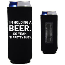 Load image into Gallery viewer, 12oz. collapsible, neoprene slim can koozie with strong magnets sewn into one side; "I'm holding a beer,,," graphic printed on the opposite side.