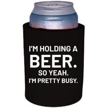 Load image into Gallery viewer, 12oz. Thick foam can koozie with "I'm holding a beer.." graphic printed on one side.