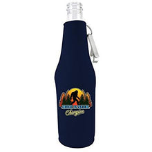 Load image into Gallery viewer, navy blue beer bottle koozie with bigfoot hide & seek text and trees design