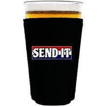 Load image into Gallery viewer, Black pint glass koozie with “send it” text with red white and blue background design