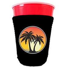 Load image into Gallery viewer, black party cup koozie with palm tree sunset design