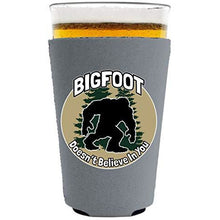 Load image into Gallery viewer, Bigfoot Doesn't Believe In You Pint Glass Coolie