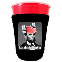Load image into Gallery viewer, black party cup koozie with Abraham drinkin' design