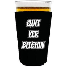 Load image into Gallery viewer, black pint glass koozie with &quot;quit yer bitchin&quot; funny text design
