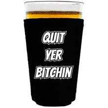 Load image into Gallery viewer, black pint glass koozie with "quit yer bitchin" funny text design