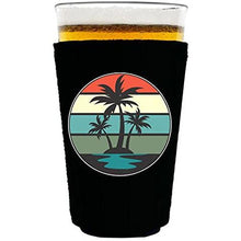 Load image into Gallery viewer, pint glass koozie with retro palm trees design 
