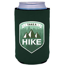 Load image into Gallery viewer, dark green can koozie with "take a hike" text and mountains and trees illustrations design