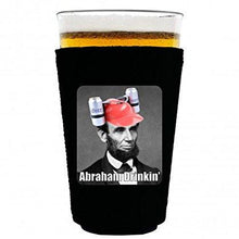 Load image into Gallery viewer, pint glass koozie with abraham drinking design