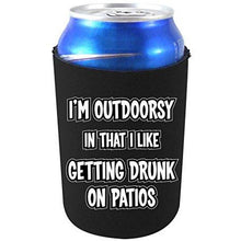 Load image into Gallery viewer, black can koozie with "i'm outdoorsy in that i like getting drunk on patios" funny text design
