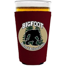 Load image into Gallery viewer, pint glass koozie with bigfoot doesnt believe in you design