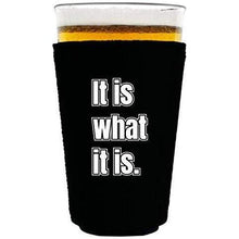 Load image into Gallery viewer, black pint glass koozie with "it is what it is" funny text design