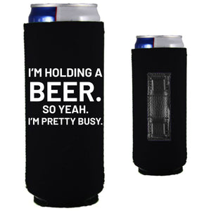 12oz. collapsible, neoprene slim can koozie with strong magnets sewn into one side; "I'm holding a beer,,," graphic printed on the opposite side.