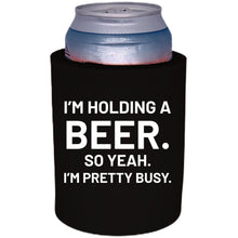 Load image into Gallery viewer, 12oz. Thick foam can koozie with &quot;I&#39;m holding a beer..&quot; graphic printed on one side.
