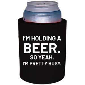 12oz. Thick foam can koozie with "I'm holding a beer.." graphic printed on one side.