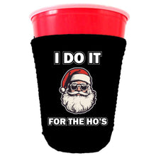 Load image into Gallery viewer, black solo cup koozie with i do it for the ho&#39;s text and santa graphic design
