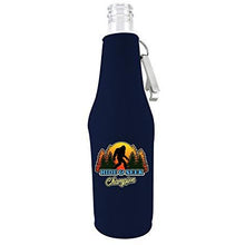 Load image into Gallery viewer, navy blue beer bottle koozie with bigfoot hide &amp; seek text and trees design
