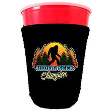 Load image into Gallery viewer, black partycup koozie with hide and seek champion design 
