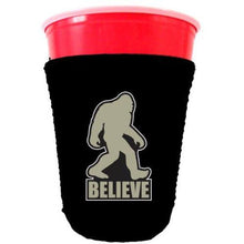 Load image into Gallery viewer, black party cup koozie with bigfoot believe design 
