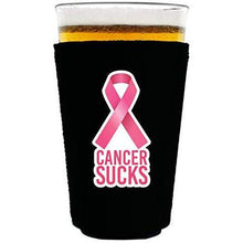 Load image into Gallery viewer, black pint glass koozie with cancer sucks text and pink ribbon graphic
