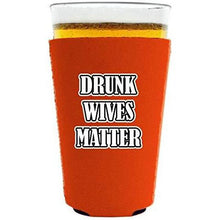 Load image into Gallery viewer, orange pint glass koozie with &quot;drunk wives matter&quot; funny text design
