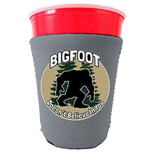 Load image into Gallery viewer, gray party cup koozie with bigfoot doesn&#39;t believe in you design 
