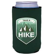 Load image into Gallery viewer, dark green can koozie with &quot;take a hike&quot; text and mountains and trees illustrations design
