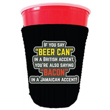 Load image into Gallery viewer, black party cup koozie with if you say beer can in a british accent you&#39;re also saying bacon in a Jamaican accent design 
