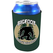 Load image into Gallery viewer, hunter green can koozie with &quot;bigfoot doesn&#39;t believe in you&quot; funny text and bigfoot silhouette in trees design
