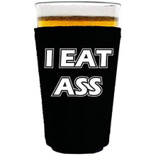 Load image into Gallery viewer, black pint glass koozie with &quot;i eat ass&quot; funny text design
