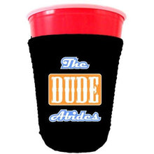 Load image into Gallery viewer, black party cup koozie with the dude abides design 
