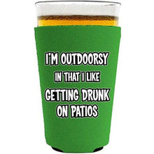 Load image into Gallery viewer, I&#39;m Outdoorsy in that I Like Getting Drunk on Patios Pint Glass Koozie
