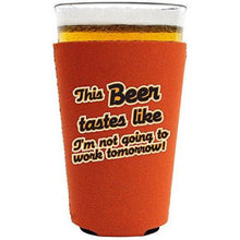 Load image into Gallery viewer, orange pint glass koozie with &quot;this beer tastes like I&#39;m not going to work tomorrow&quot; funny text design
